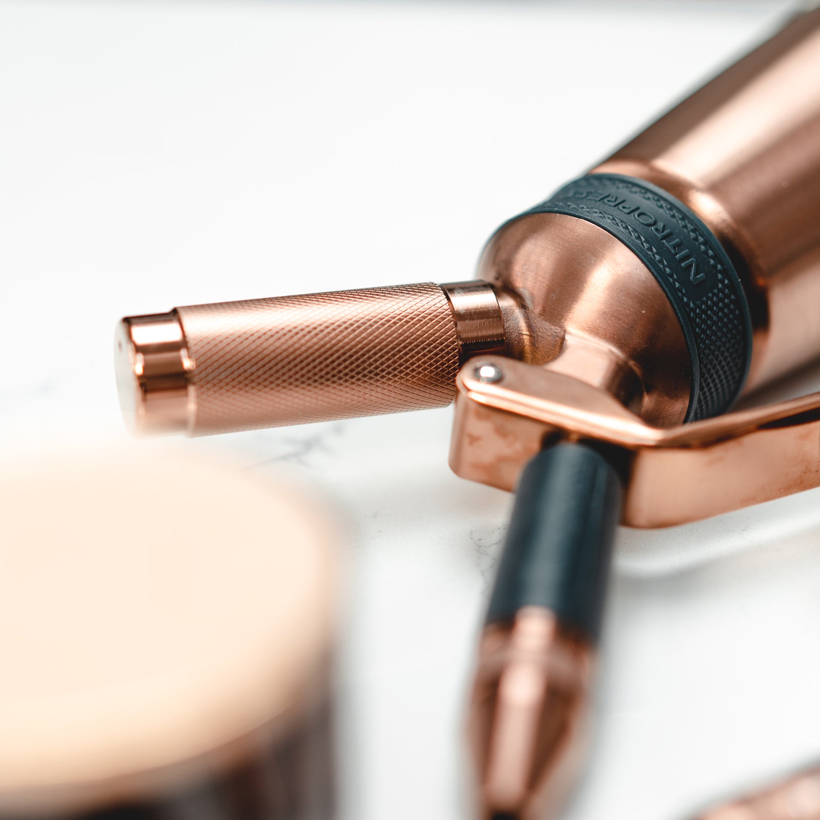 Nitro nozzle on copper edition nitro press